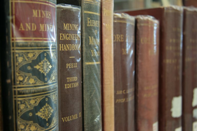 Spines of books from Camborne School of Mines Historical Library