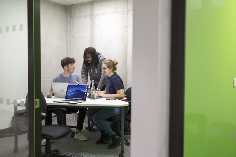 Group working in study room with laptop