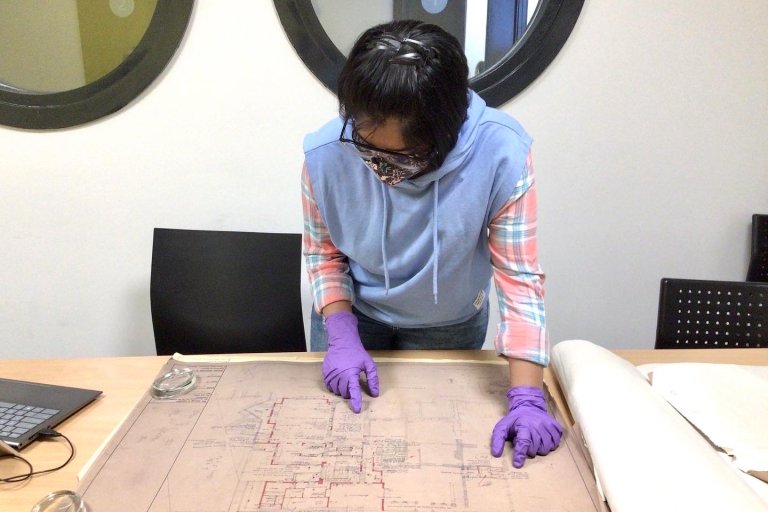 Studend on placement working on a series of architectural plans