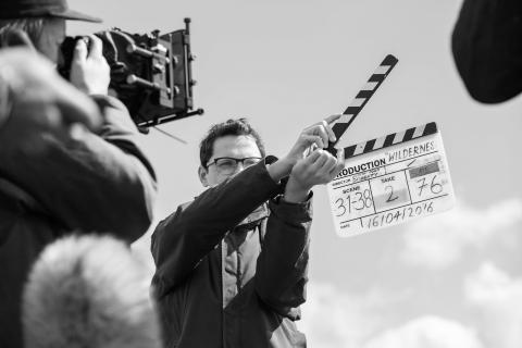Cameraman filming classic clappers