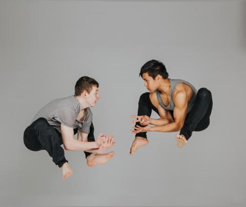 Two dancers mid-air