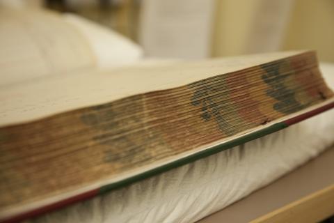 Photograph page ends of Camborne School of Mines Student Admissions register volume.